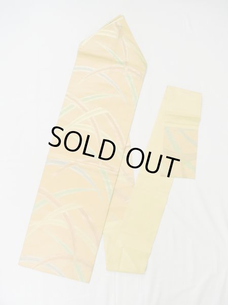 画像1: L0707B 名古屋帯 女性用着物 シルク（正絹）  淡い 橙色 芝草 【中古】 【USED】 【リサイクル】 ★★★☆☆ (1)